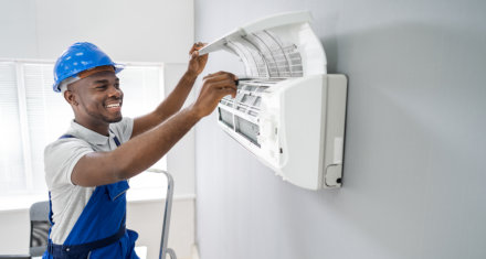 Repairer conducts adjustment of the indoor unit air conditioner