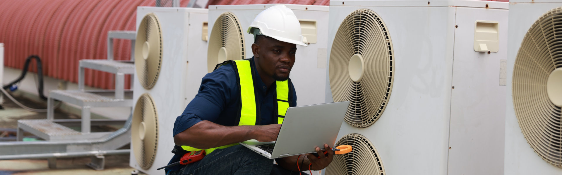 Repairman monitoring HVAC